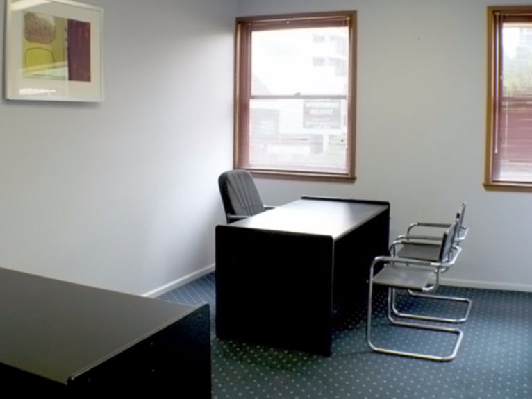 Single office with desk and visitors chairs